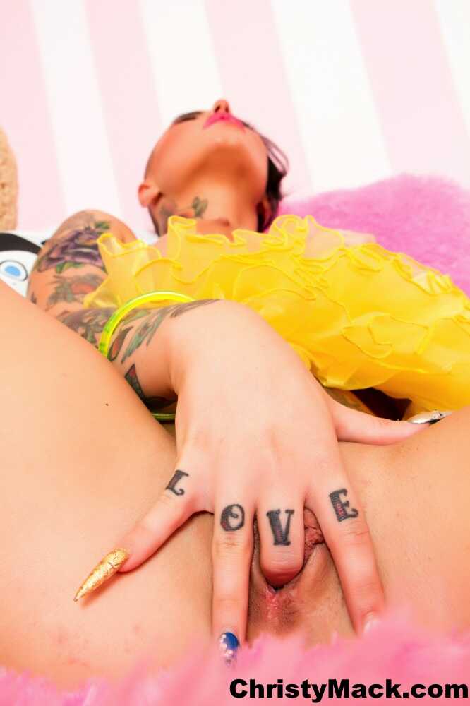 Tattooed slut Christy Mack's big tits get unveiled as she fingers her horny beaver. - Christy Mack