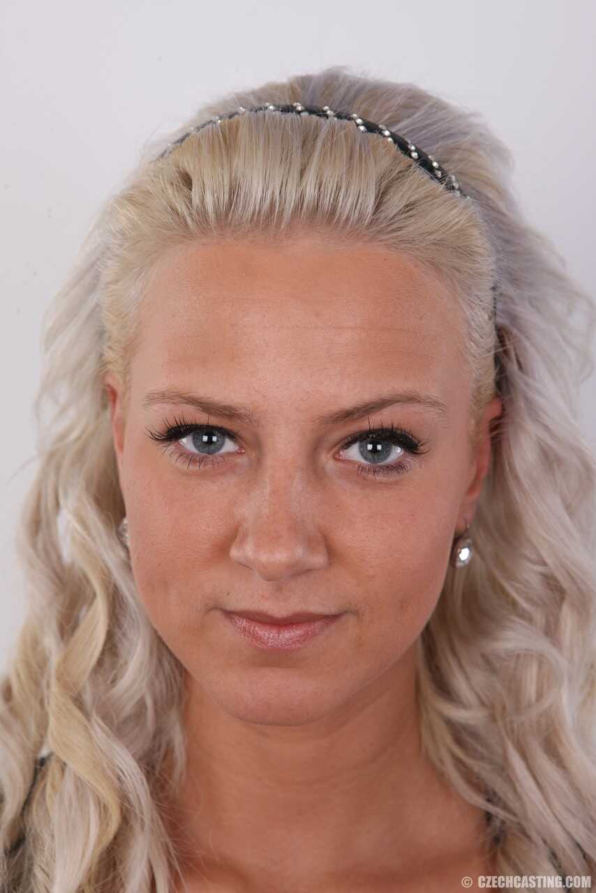 Busty blonde Nathaly Cherie strips down for a naughty photo shoot with her natural saggy tits and pierced pussy on display...