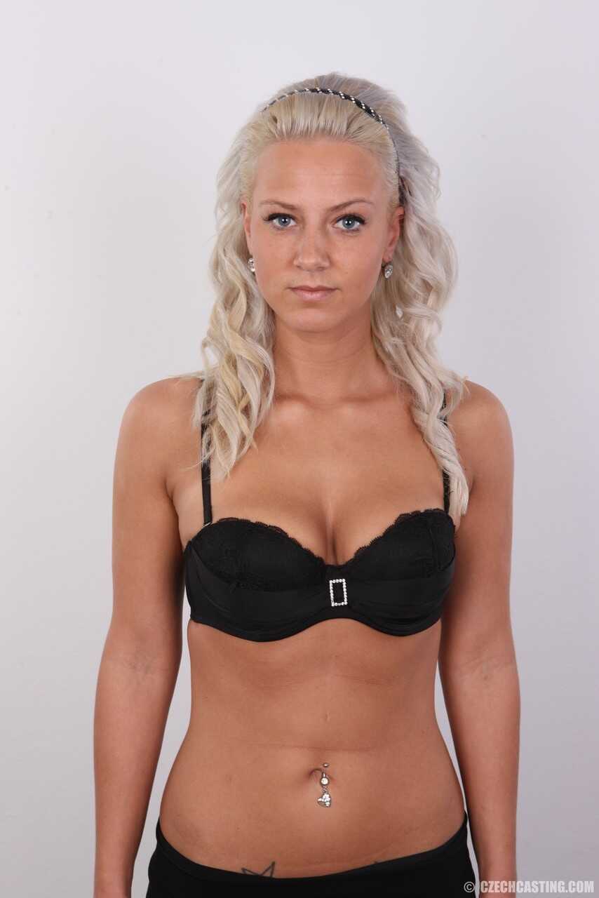 Busty blonde Nathaly Cherie strips down for a naughty photo shoot with her natural saggy tits and pierced pussy on display...