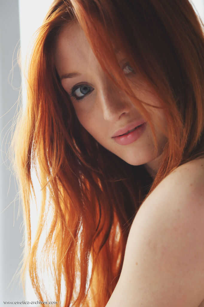 Exposed Redhead Babe: Micca's Red Fox Nakedness on the Bed Sheets