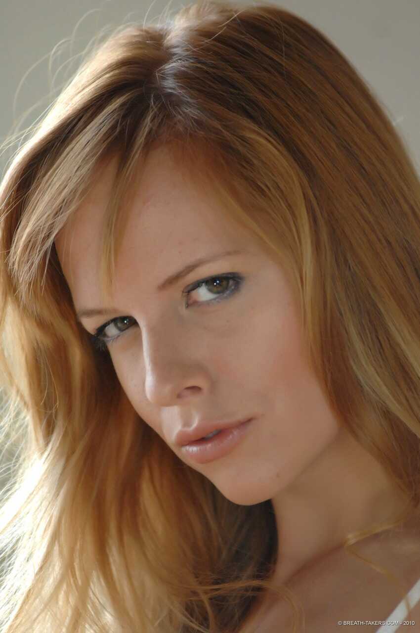 Carmen Gemini's Red Hot Jeans Drop: Big Tit Redhead Strips Down to Thong for Seductive Pose - Carmen Gemini