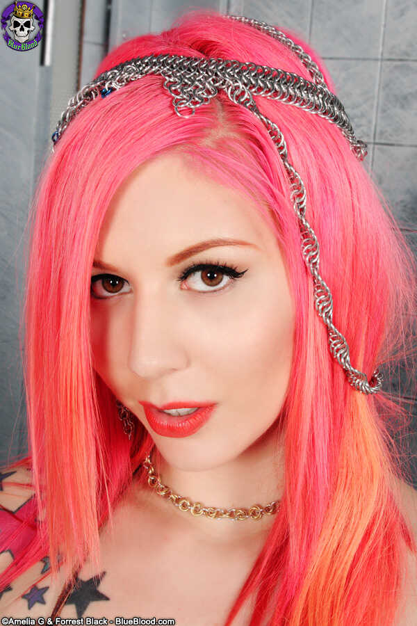 Solo girl with dyed haired Annalee Belle shows off her tattooed body in the nude while playing with her big redhead ass an...