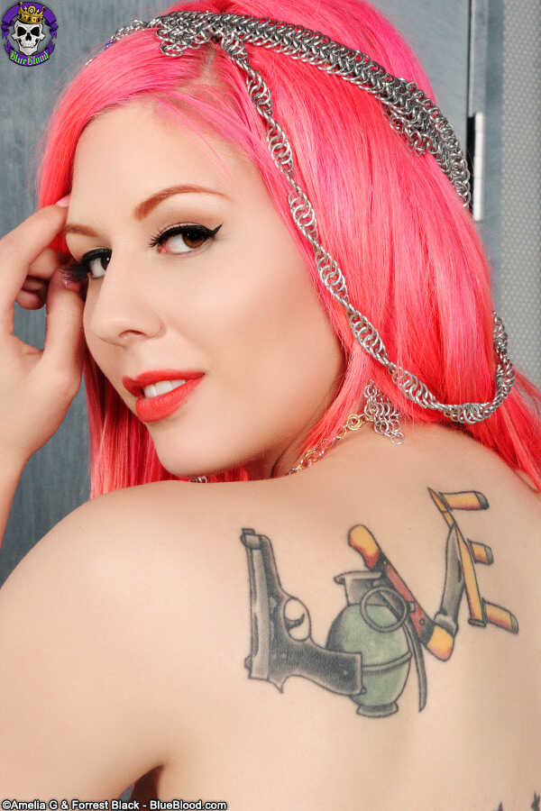 Solo girl with dyed haired Annalee Belle shows off her tattooed body in the nude while playing with her big redhead ass an...
