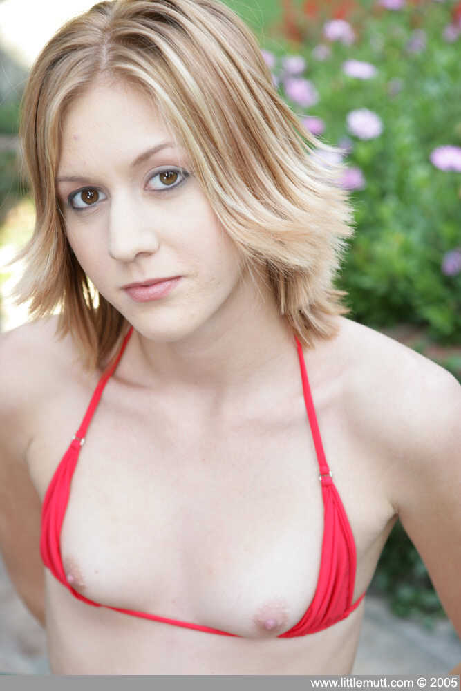 Skinny young Alex Venice shows off her small tits in a bikini top