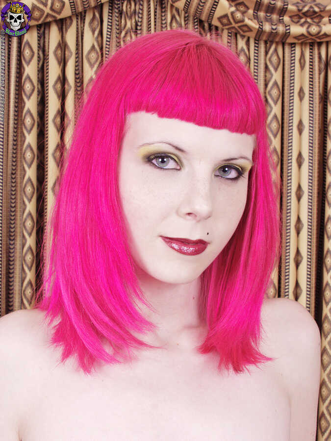 Pink-haired Szandora strips down to her corset and shows off her busty MILF body - Szandora
