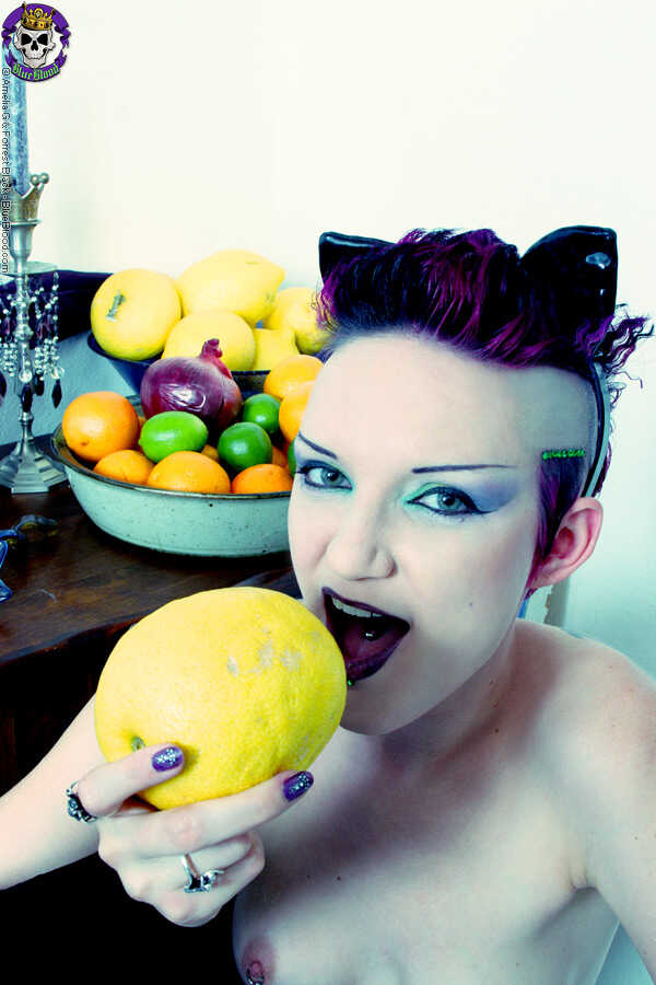 Gothic Seductress Scar 13 Sucks Lustfully on Citrus Fruits While Nude in Boots