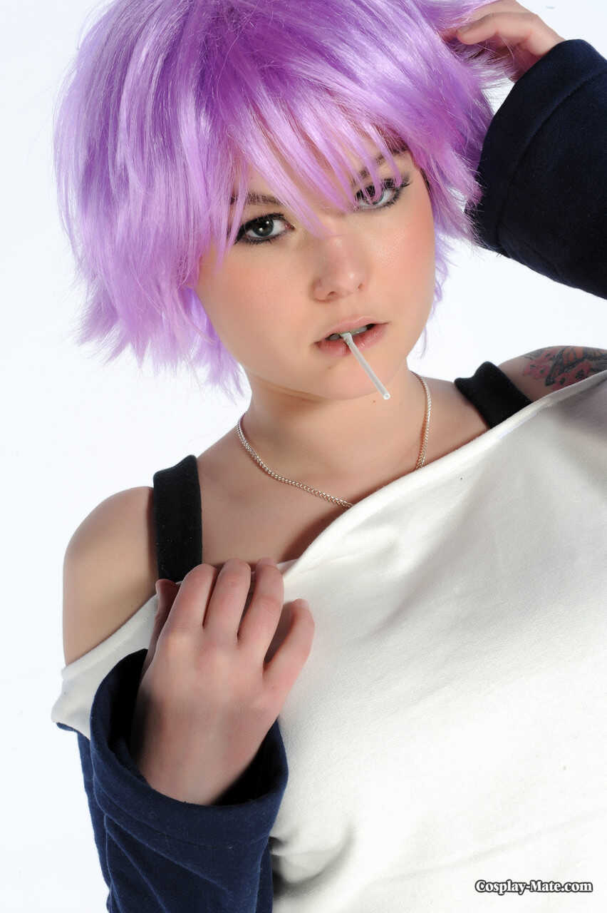 Purple haired girl Kasey Olsen spreading her pussy with lollipop in her mouth while wearing cosplay pussy and lingerie, sh...