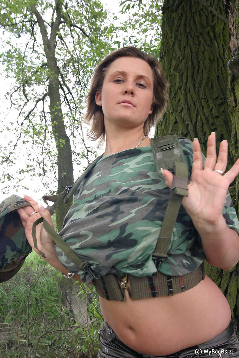 Solo girl Lea Ticia fondles her large boobs amid trees in military attire - Lea Ticia