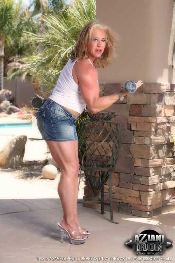 Older blonde bodybuilder Wanda Moore flexes on the patio before masturbating   Mature Blonde Muscle Goddess Flexes and Jer...