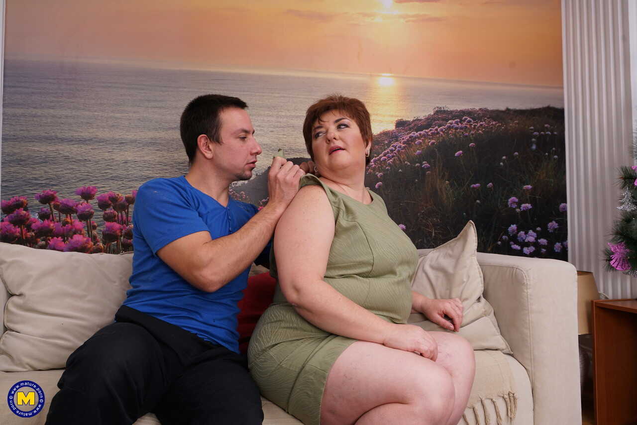 Sexy mature BBW bares her great big tits for her young boy toy to suck on - Jelena M