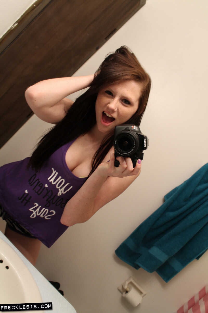 Freckles 18 sticks out her tongue while taking mirror selfies in her lingerie, giving us a sexy big tits selfie. - Freckle...