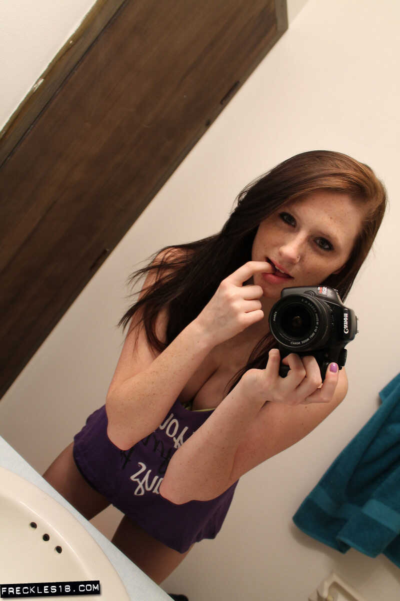Freckles 18 sticks out her tongue while taking mirror selfies in her lingerie, giving us a sexy big tits selfie. - Freckle...