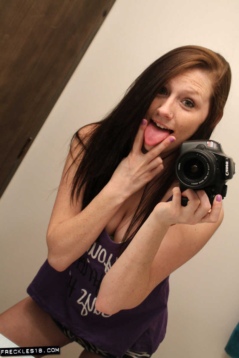 Freckles 18 sticks out her tongue while taking mirror selfies in her lingerie, giving us a sexy big tits selfie. - Freckle...