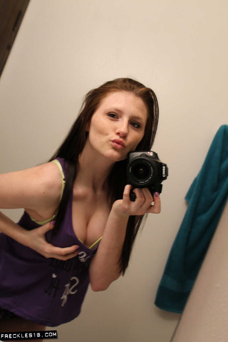 Freckles 18 sticks out her tongue while taking mirror selfies in her lingerie, giving us a sexy big tits selfie. - Freckle...