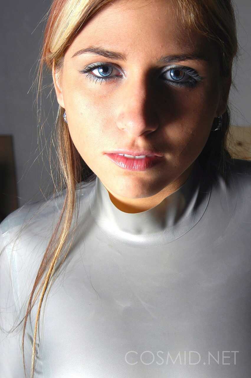 Blue eyed amateur Tara posing to flaunt her massive tits in skin tight latex. - Tara Bush