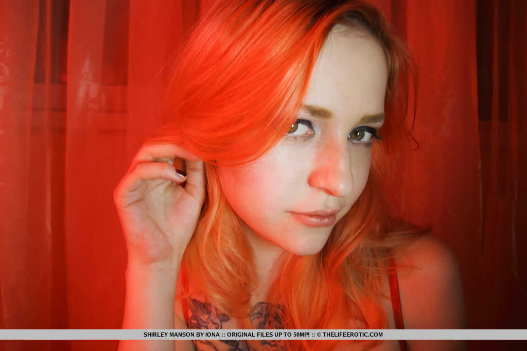 Inked redhead babe Shirley Manson strips and plays with her shaved coochie for you! - Shirley Manson