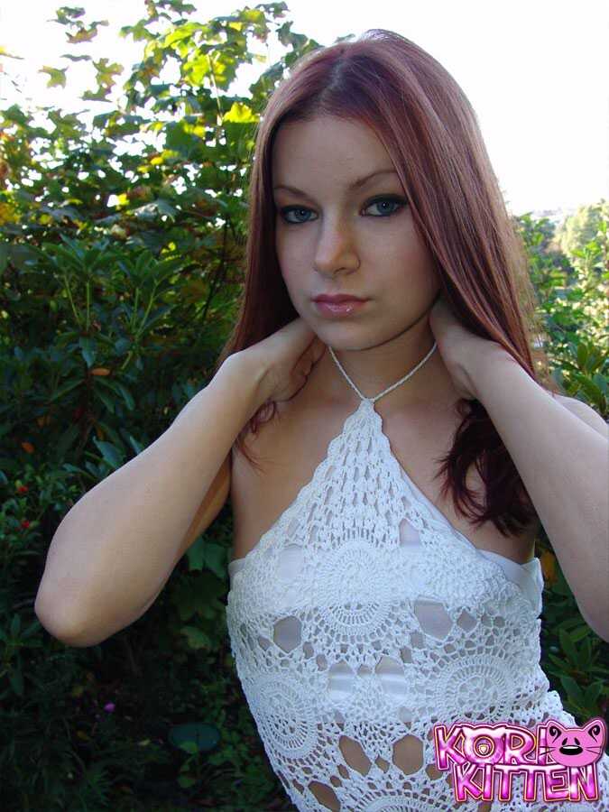 Busty Amateur Model Korina Bliss Exposes her Naked Breasts and Shows off her Perky Redhead Asset on the Back Lawn - Korina...
