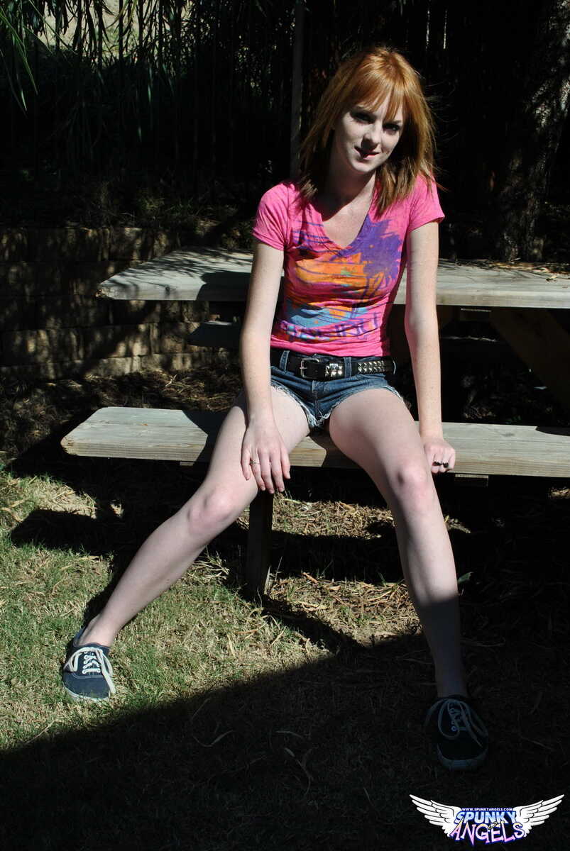 Young redhead Kate Cooper hikes her skirt and flashes her twat against a fence Amateur Redhead, British Teen, British Amat...