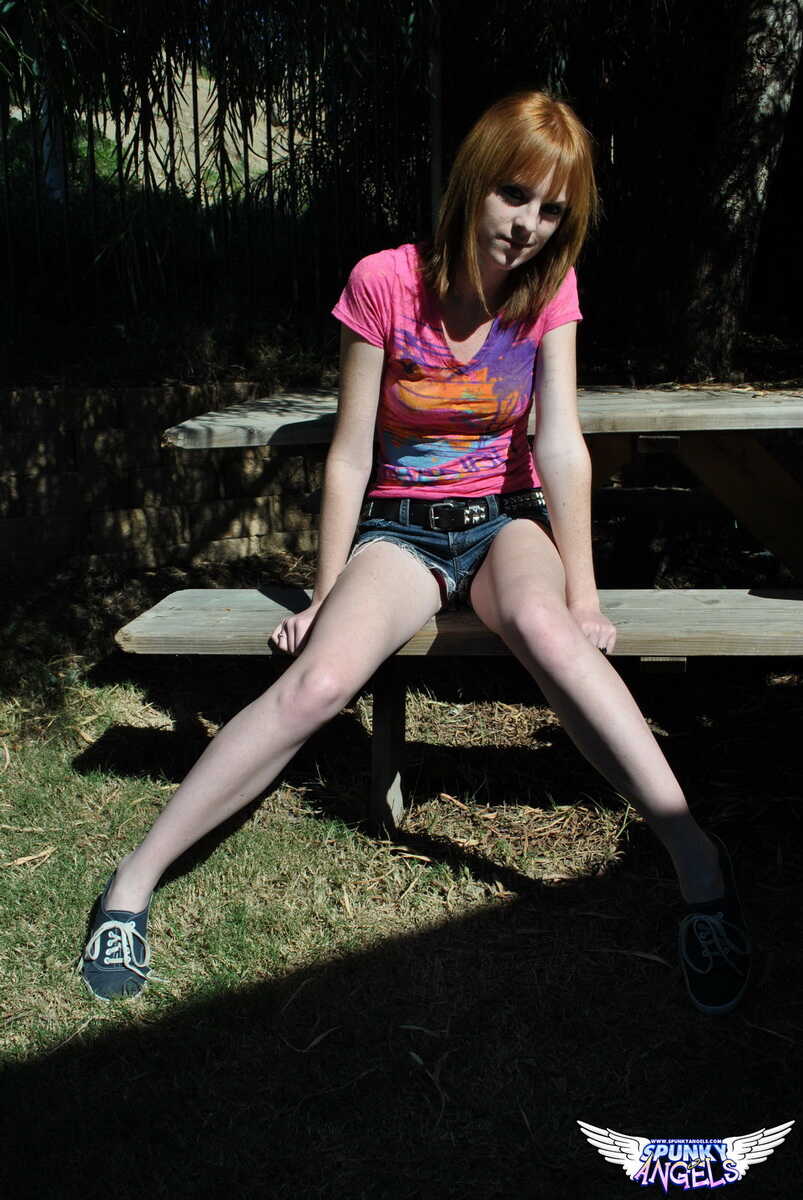 Young redhead Kate Cooper hikes her skirt and flashes her twat against a fence Amateur Redhead, British Teen, British Amat...