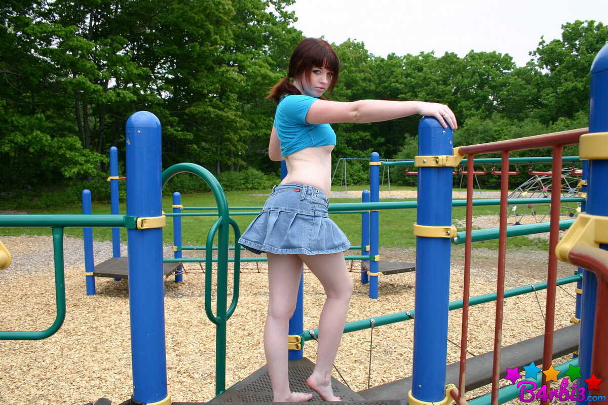 Naughty Pigtailed Ginger Barbie Plays with Her Perky Tits at the Playground