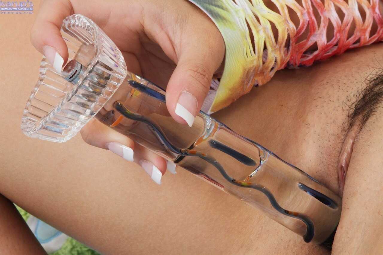 Busty Asian teen Maily pleasures her landing strip pussy with a dildo while showing off her big natural tits and hairy vag...