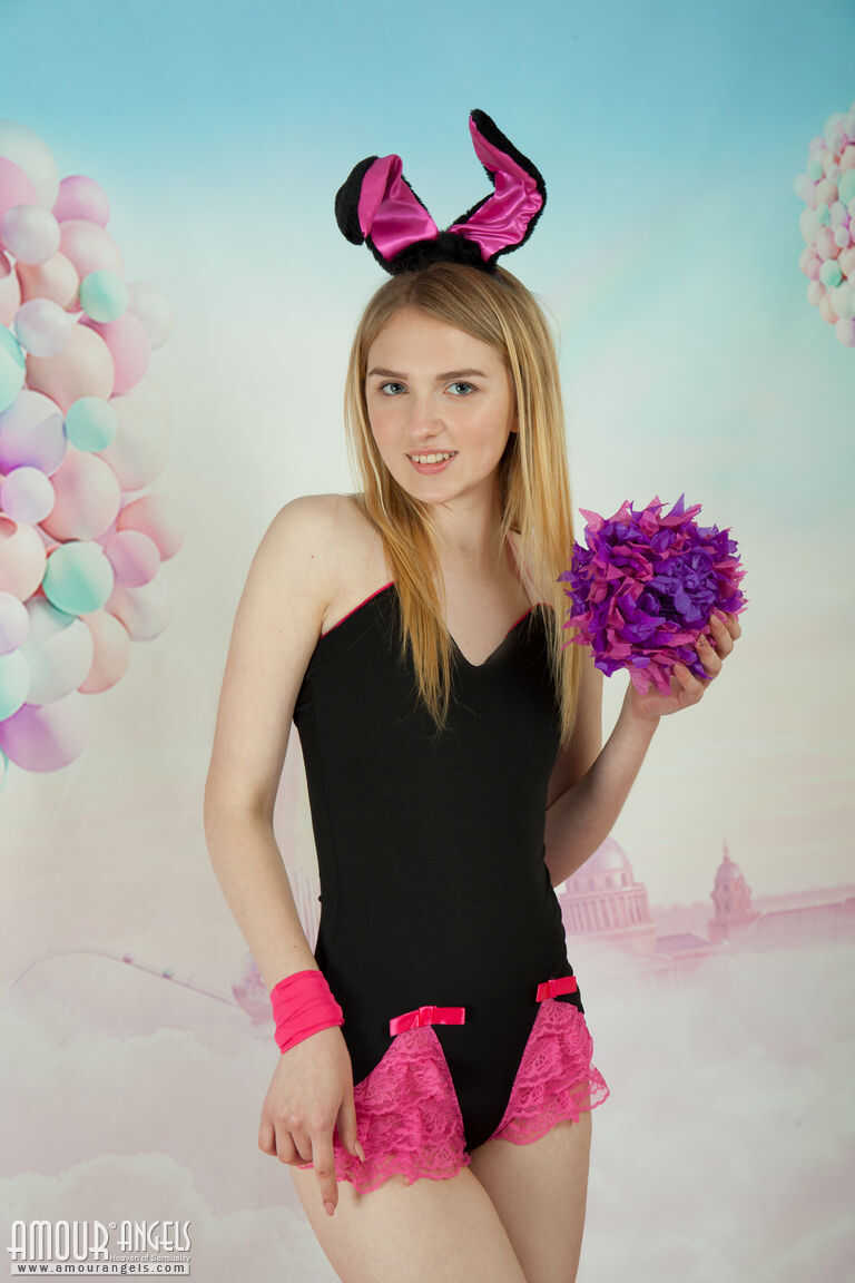 Exposing her innocent bunny ears, Lia strips naked and shows off her petite tits! - Lia Kate