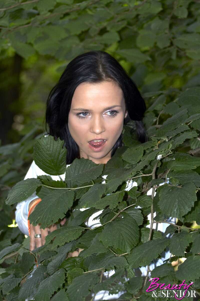 Dark haired seductress takes control of her older prey, deep in the forest