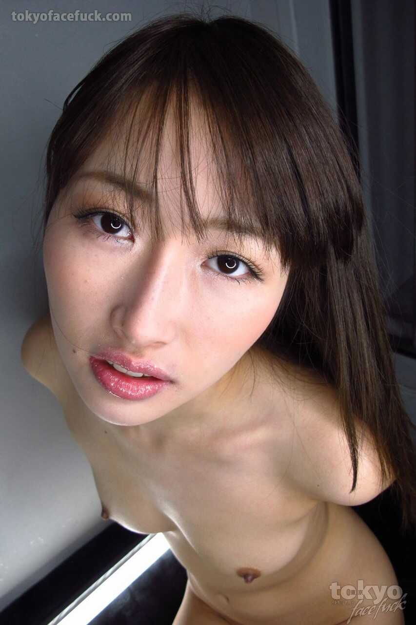 Japanese teen Mana Aoki is masturbated with a sex toy after sucking cock on her knees