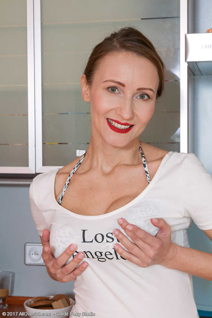 MILF Alena K Busts Out Her Massive Booty and Fingers Her Wet Pussy in the Kitchen - Alena K