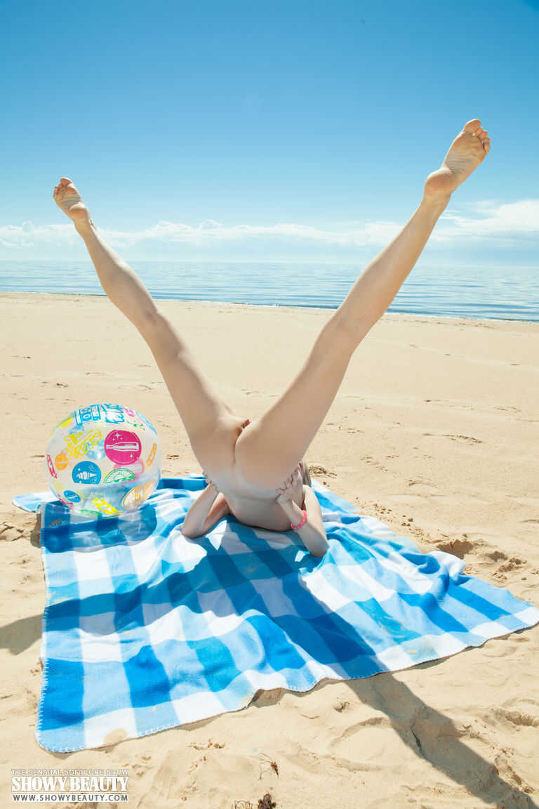 Barely Legal Danielle Soul Gets Naked atop a Blanket on the Beach 