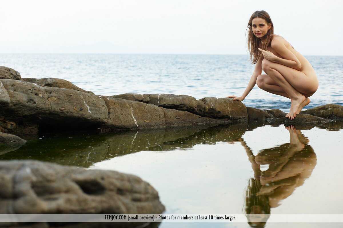 Fibby's Perfect Ass on Display as She Climbs Rocks Naked at the Beach