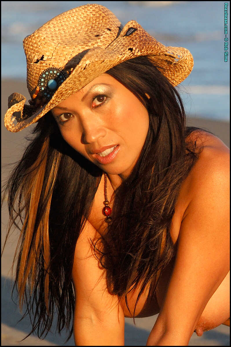 Rossie Cottrell shows off her bountiful bosom on the Asian Big Tits beach in a straw hat! - Rossie Cottrell