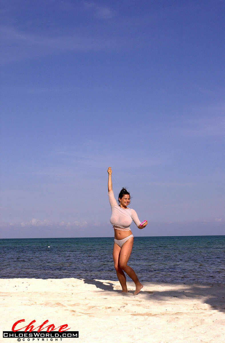 Super busty Chloe Vevrier letting her massive big tits hang loose at the beach while she enjoys some mature beach action o...