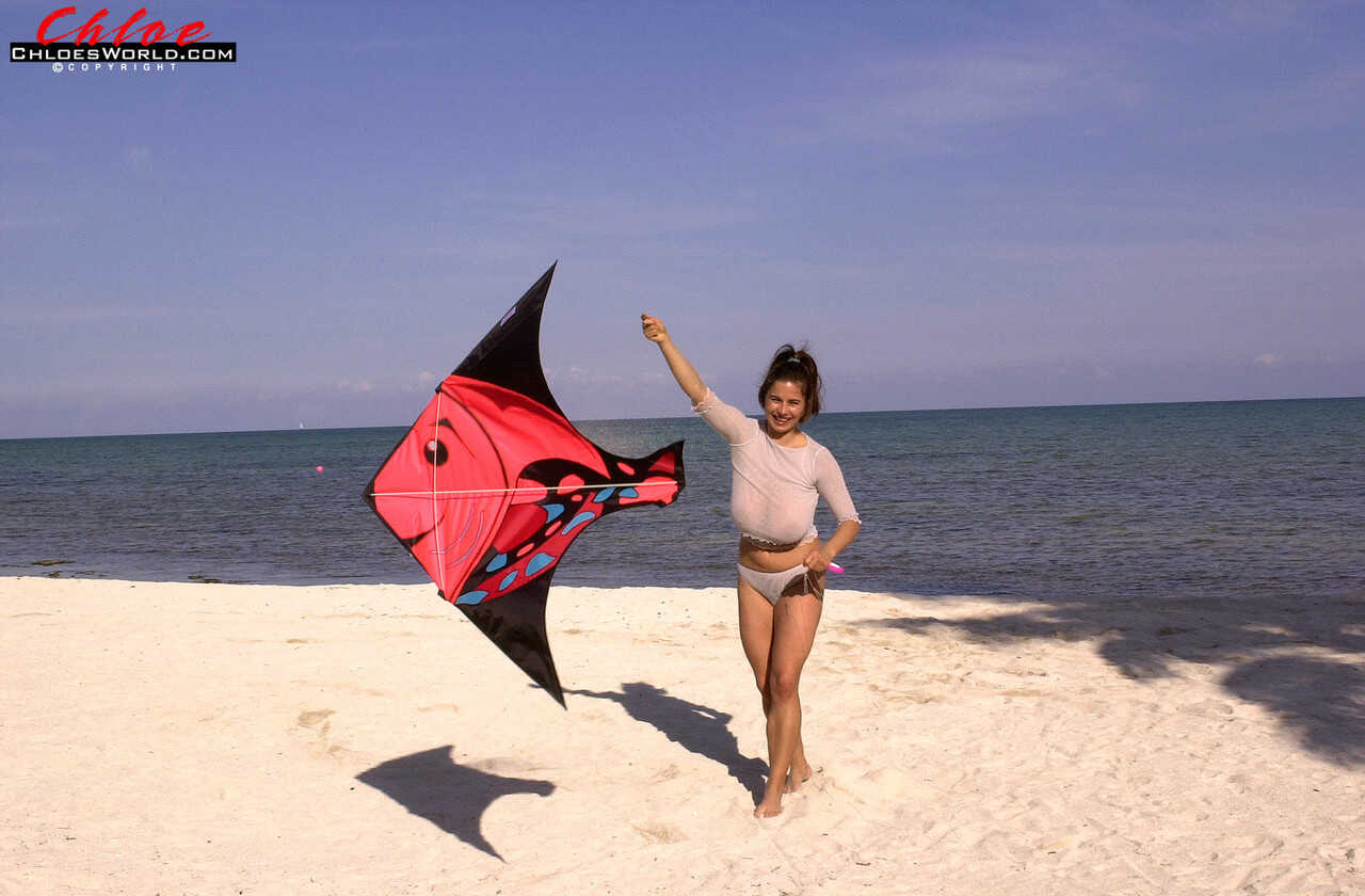 Super busty Chloe Vevrier letting her massive big tits hang loose at the beach while she enjoys some mature beach action o...