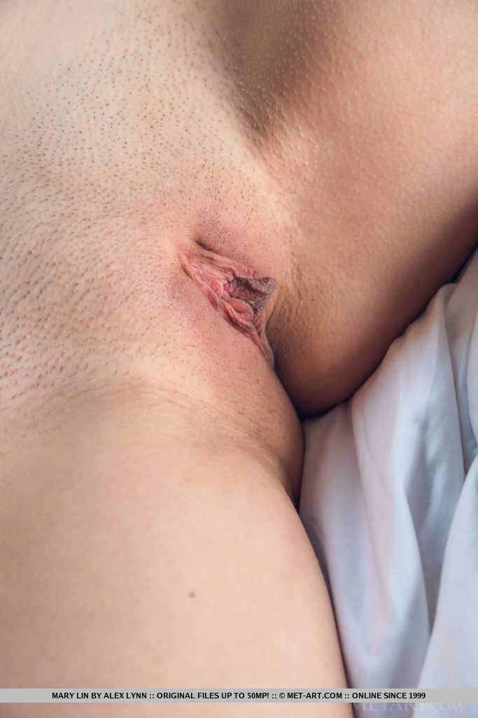 Young blonde Mary Lin uncovers her tight ass before showing off her beautiful pussy - Mary Lin