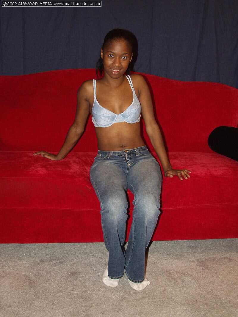 Black Monique shows the pink of twat after stripping to small white socks - Monique