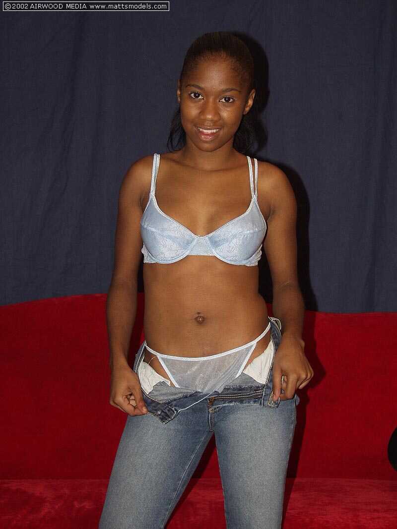 Black Monique shows the pink of twat after stripping to small white socks - Monique