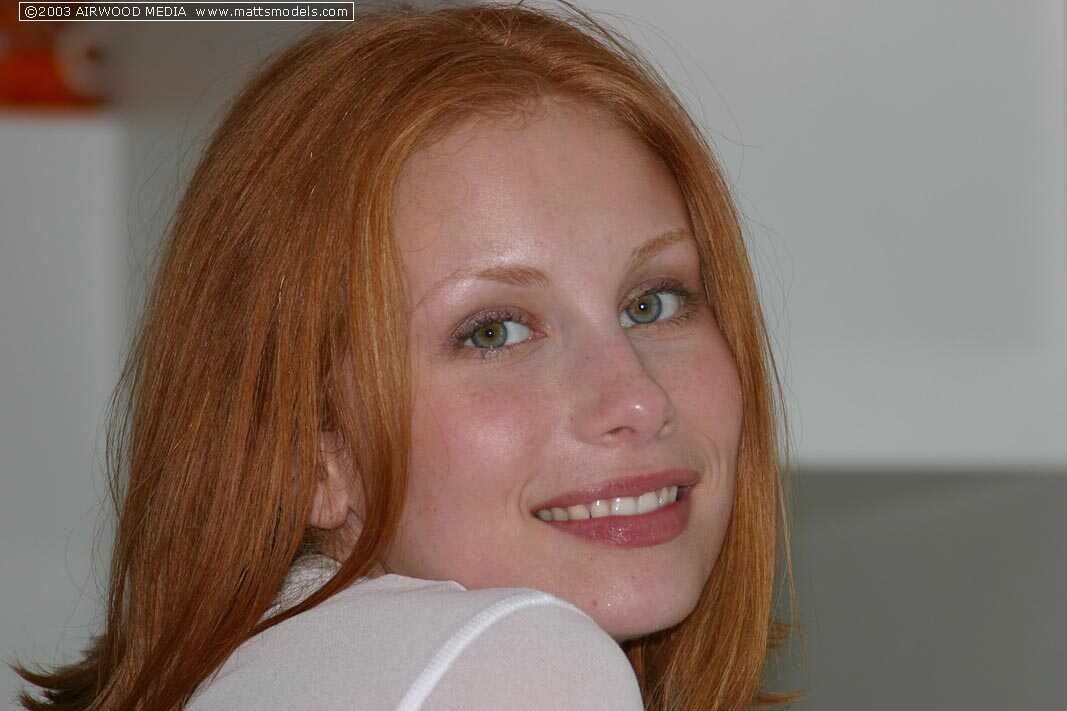 Sexy Redhead Anya Poses Naked On Kitchen Counter With A Black Choker And Big Tits - Anya