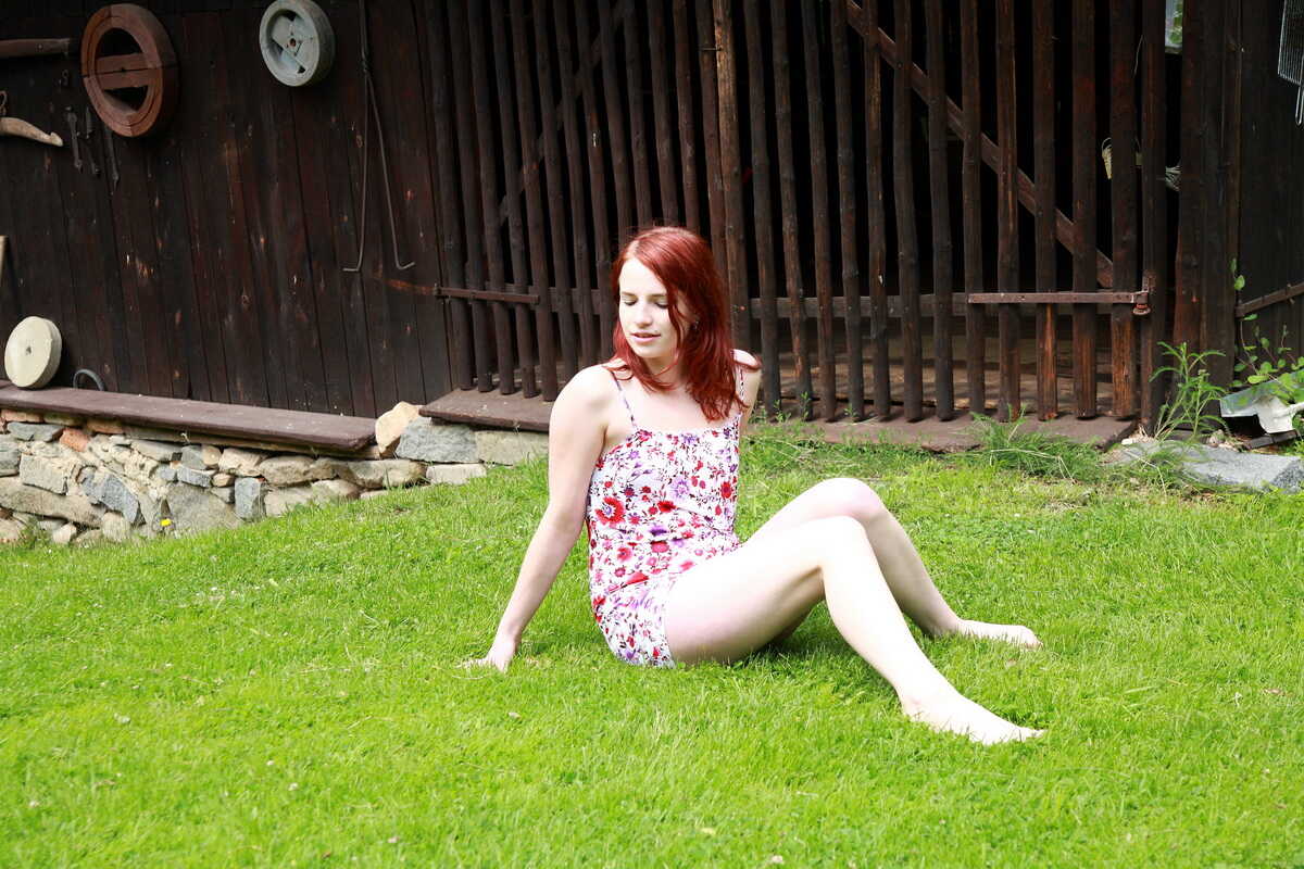 Jarmila's Outdoor Delight: A Young Natural Redhead Masturbates on a Back Lawn in the Buff