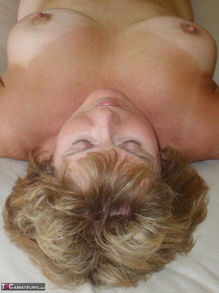 Mature Lady BustyBliss Lets Her Cat Lick Her Shaved Pussy While Naked on Her Bed - BustyBliss