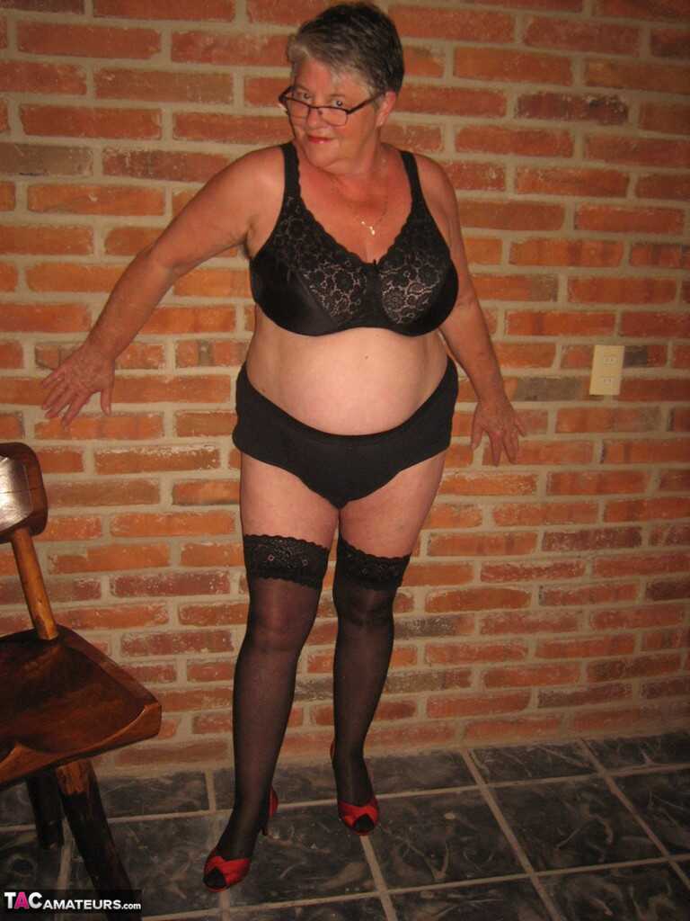 Fat old woman strips to black stockings and heels with her glasses on  Granny's Secret Fantasy: A Night of Black Stockings and Heels