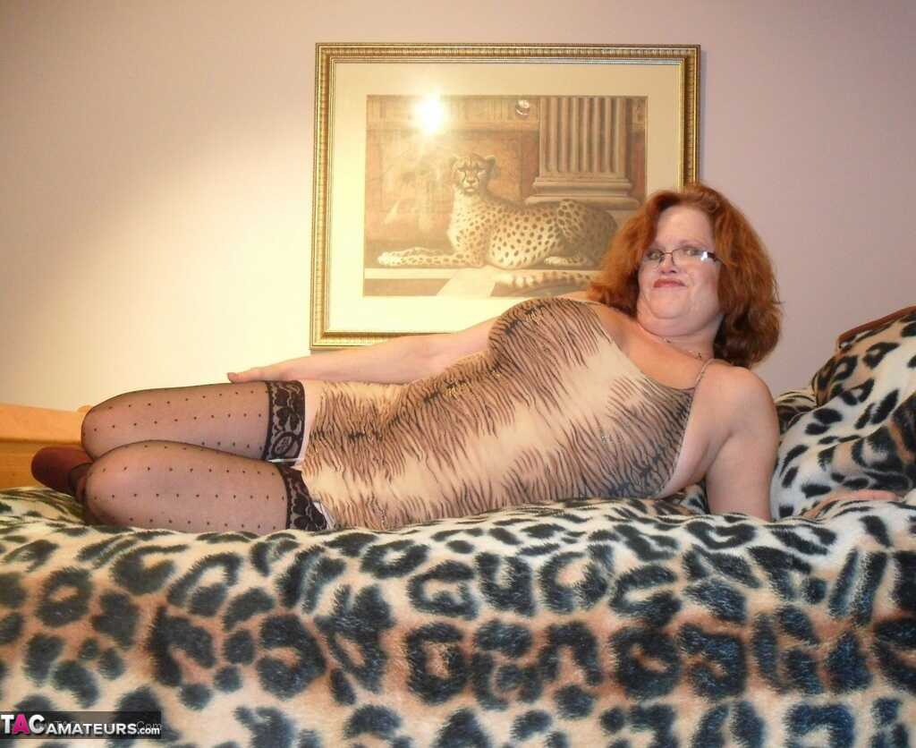 Busty Older Redhead Misha MILF Sucks a Big Dildo in Bed After Spreading Her Shaved Pussy - Misha Milf