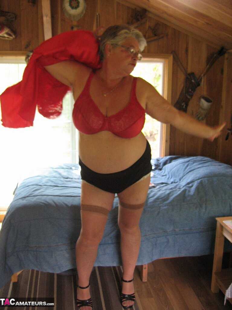 Short haired granny Girdle Goddess strips off her stockings and high heels, exposing her hairy pussy to the camera! - Gird...