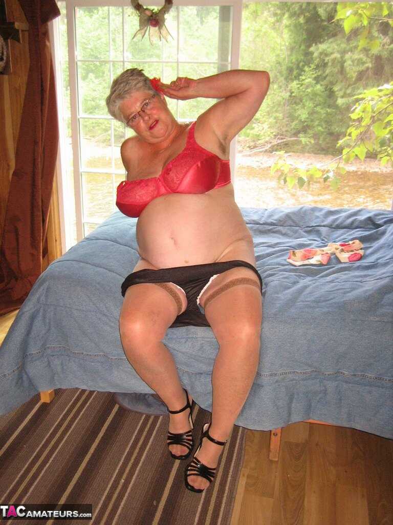 Short haired granny Girdle Goddess strips off her stockings and high heels, exposing her hairy pussy to the camera! - Gird...