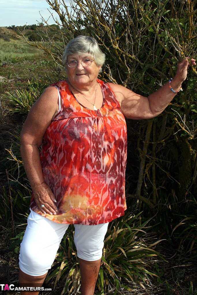 Granny's Garden of Eden Obese nan Grandma Libby strips totally naked out by evergreen trees - Grandma Libby