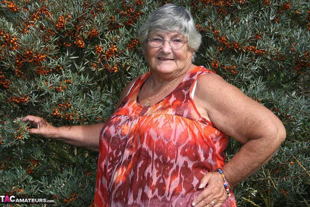 Granny's Garden of Eden Obese nan Grandma Libby strips totally naked out by evergreen trees - Grandma Libby