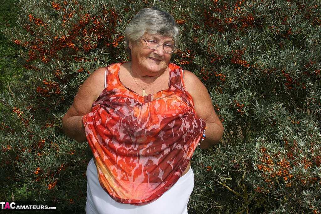 Granny's Garden of Eden Obese nan Grandma Libby strips totally naked out by evergreen trees - Grandma Libby