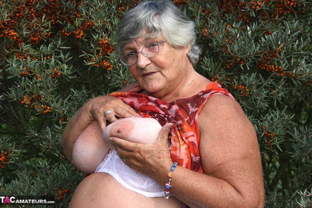 Granny's Garden of Eden Obese nan Grandma Libby strips totally naked out by evergreen trees - Grandma Libby