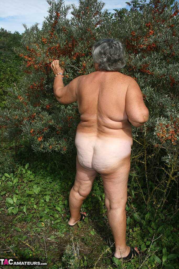 Granny's Garden of Eden Obese nan Grandma Libby strips totally naked out by evergreen trees - Grandma Libby