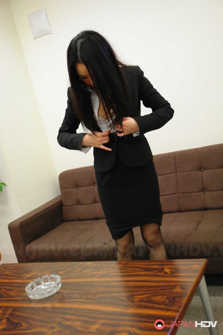 Japanese business woman Ai Mizushima hitches up her skirt to finger fuck her wet pussy in the office - Ai Mizushima